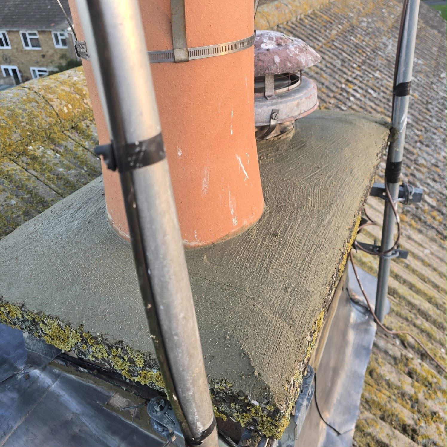 Chimney repairs Glasgow: new flaunching formed around a clay chimney pot