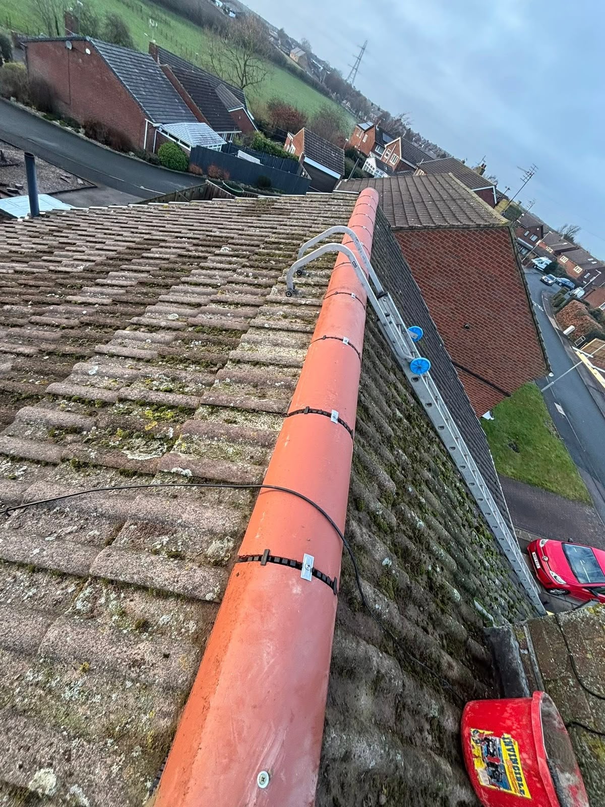 Roofing Glasgow: dry fix ridge system installed on a weathered tiled roof